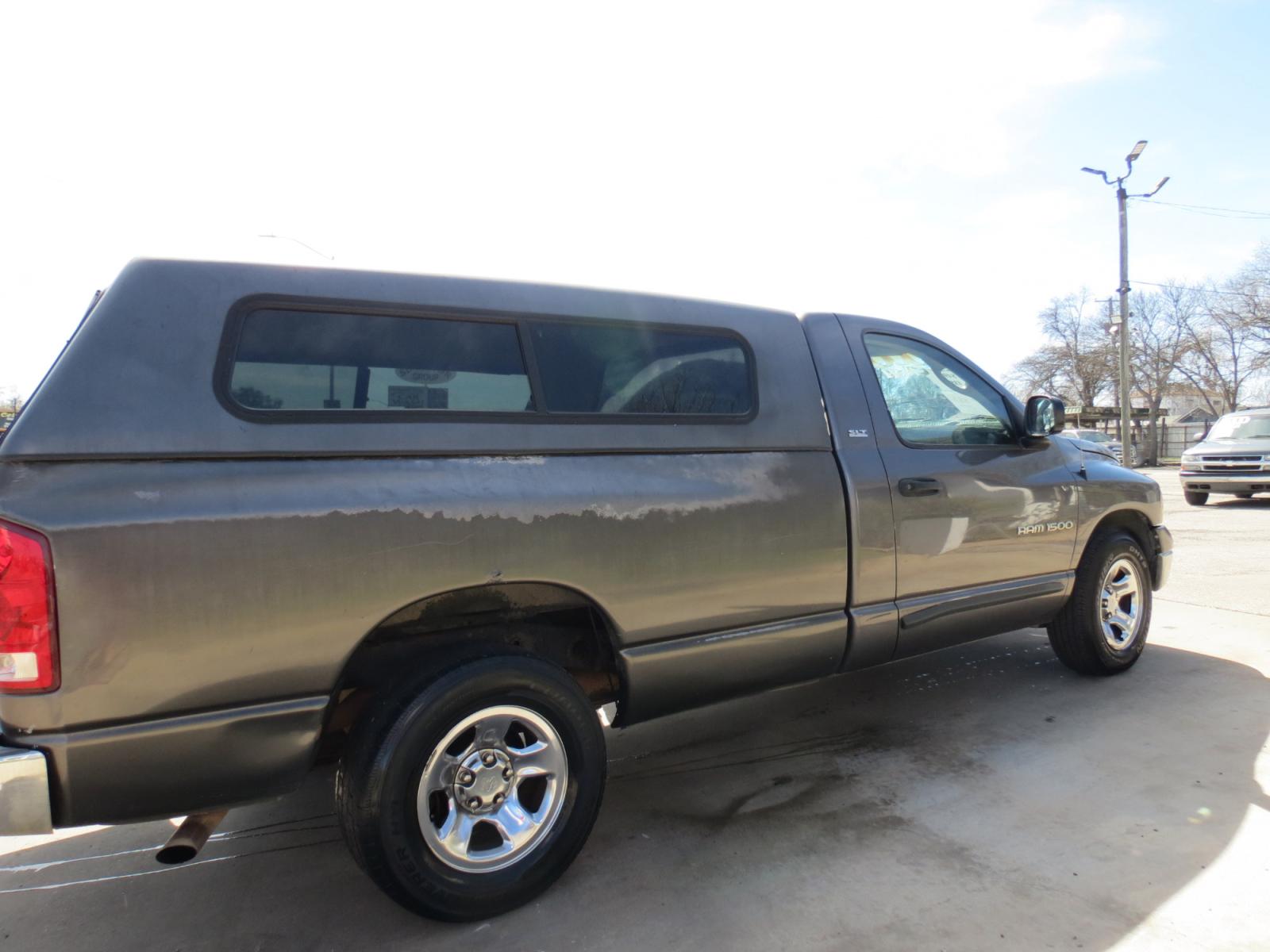 2002 Gray Dodge Ram 1500 SLT Long Bed 2WD (1D7HA16N72J) with an 4.7L V8 SOHC 16V engine, Automatic transmission, located at 3624 Hemphill St., Fort Worth, TX, 76110, (817) 926-8921, 32.696205, -97.331985 - Photo #4